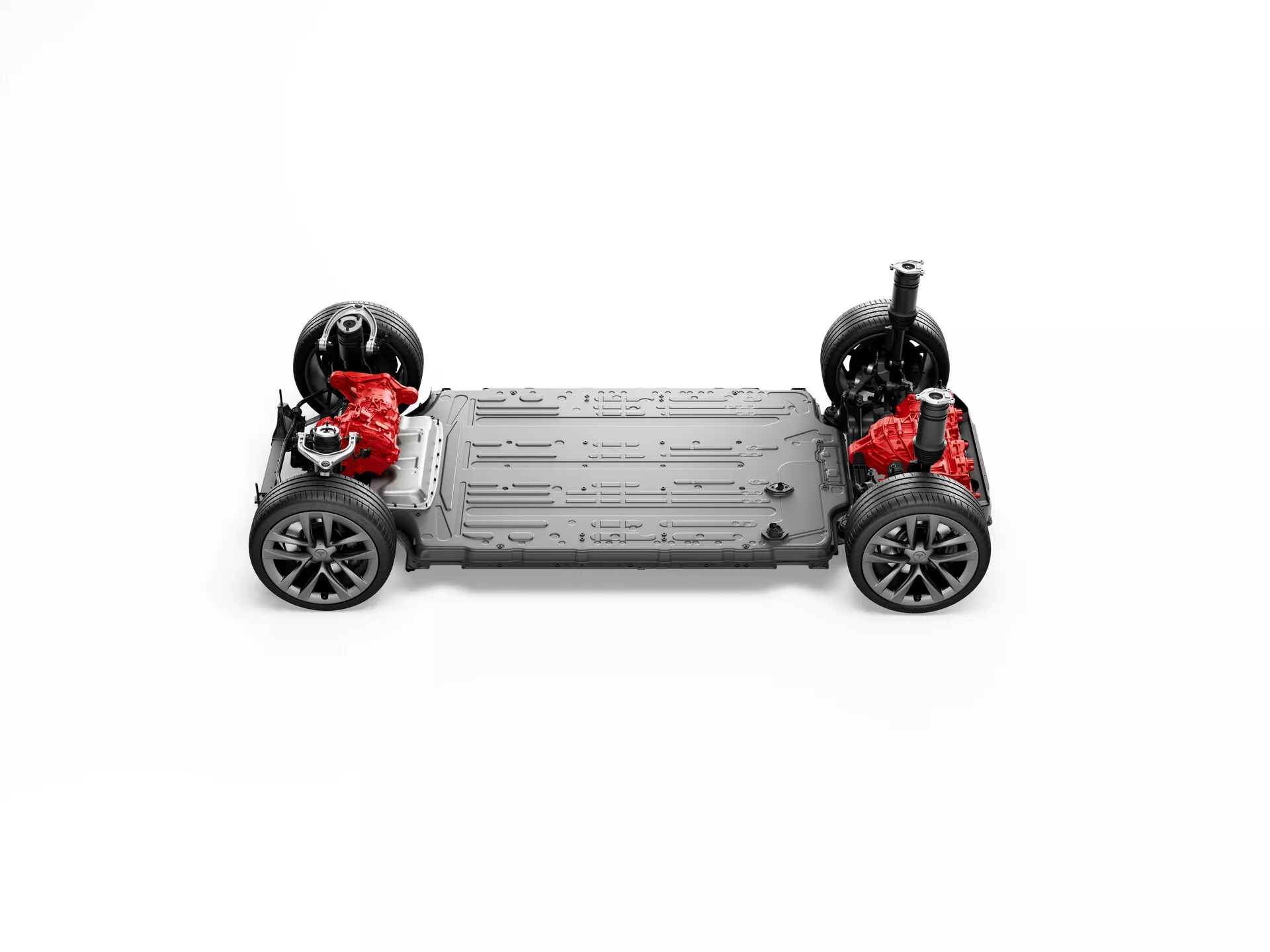 Vista dall'alto simmetrica del telaio del veicolo elettrico Tesla Model S 2016 (prima generazione facelift), con quattro ruote, assi, elementi di sospensione indipendenti, grande pacco batteria centrale e due motori elettrici rossi che suggeriscono capacità di trazione integrale, sullo sfondo bianco neutro.